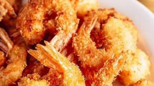 Camarones Empanizados · Crispy breaded shrimp served with your choice of two sides.