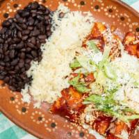 Chicken Enchiladas Rancheras · Chicken Enchiladas topped with Mole Sauce, lettuce and cheese