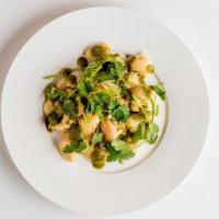 Vindy Side Broad Bean Chutney Salad · Slowly cooked butter beans topped with cilantro chutney.