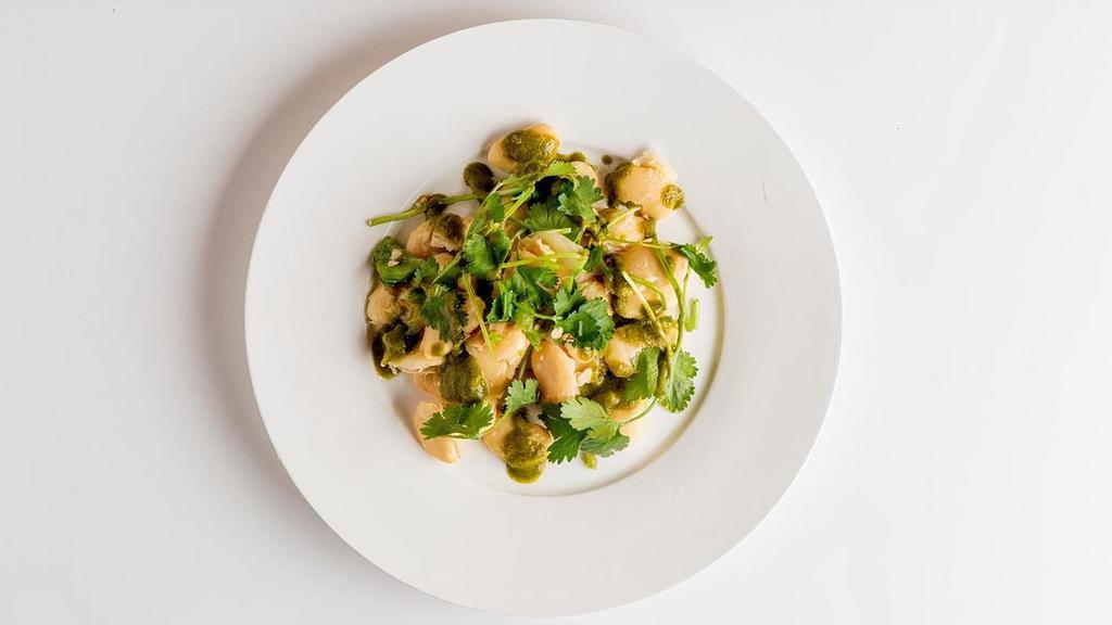 Vindy Side Broad Bean Chutney Salad · Slowly cooked butter beans topped with cilantro chutney.