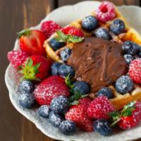 Homestyle Waffles With Mixed Berries · Hot & Tasty Homestyle waffles, served hot off the griddle. Topped with fresh mixed berries, ...