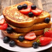 Country Style French Toast With Mixed Berries · Fluffy, Country-style French Toast, served hot off the griddle. Topped with fresh mixed berr...