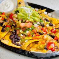 Nachos · Any protein, melted cheese, black beans, pico de gallo, guacamole, sour cream and pickled ja...