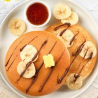 Baby Banana Nutella Pancakes · Fluffy banana nutella pancakes cooked with care and love served with butter and maple syrup....