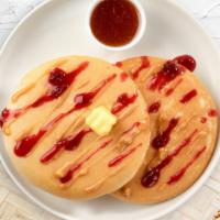 Peanut Butter Bliss Pancakes · Fluffy peanut butter and jelly pancakes cooked with care and love served with butter and map...