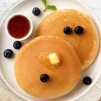 Feeling Blueberry Pancakes · Fluffy pancakes cooked with care and love served with blueberries, butter and maple syrup. S...