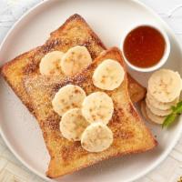 Wanna Banana French Toast · Fresh bread battered in egg, milk, and cinnamon cooked until spongy and golden brown. Topped...