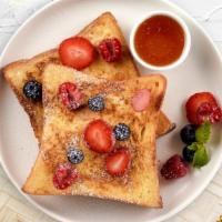 Very Berry French Toast · Fresh bread battered in egg, milk, and cinnamon cooked until spongy and golden brown. Topped...