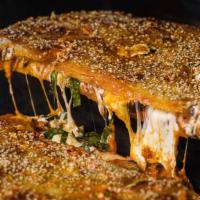 Simp Parm · sharable stuffed calzone with creamy burrata, pink vodka sauce, fresh, smoked & dry aged moz...
