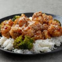 Sesame Chicken · Sliced chicken deep fried to crisp with delicious sesame seed sauce. Served with rice.