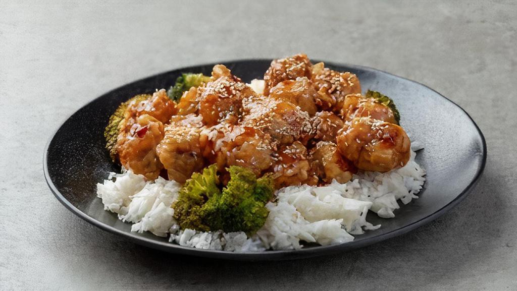 Sesame Chicken · Sliced chicken deep fried to crisp with delicious sesame seed sauce. Served with rice.