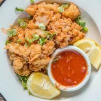 Crispy Calamari · Served with tomato sauce and cherry peppers.