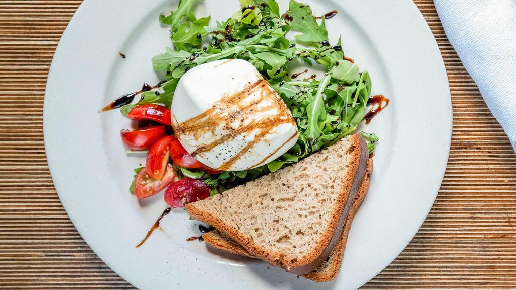 Fresh Burrata · Arugula, cherry tomato, and topped with balsamic reduction.