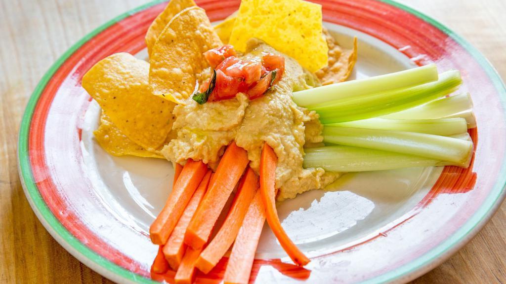 Homemade Hummus · Tortilla chips, carrots, and celery.