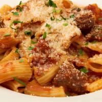 Rigatoni Ragu · With lamb sausage and red sauce.