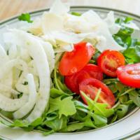 Wild Salad · Wild arugula, shaved fennel, cherry tomatoes, Parmigiano, and lemon dressing. Gluten free.