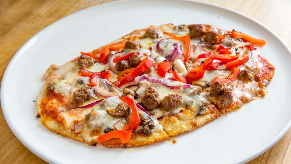 Mediterranean Pizza · Roasted red pepper , onions, mozzarella, lamb sausage, and tomato sauce.