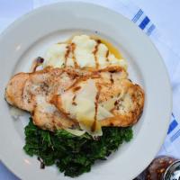 Roasted Chicken Cutlets · Roasted chicken cutlets topped with a bed of sauteed kale, balsamic reduction, parmigiano ch...