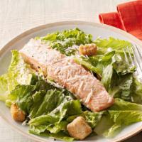 Salmon Caesar Salad · Gluten-free croutons , parmesan cheese and Caesar dressing .