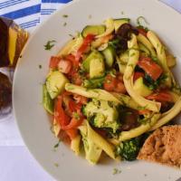 Garganelli Primavera · Pasta with wine butter sauce and mixed vegetables.