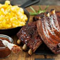 Half Rack · St. Louis style pork ribs are pit-smoked for 4 hours over a smoldering hickory fire. Then sl...