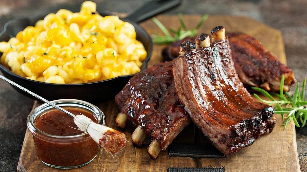 Half Rack · St. Louis style pork ribs are pit-smoked for 4 hours over a smoldering hickory fire. Then slathered over an open flame to seal in the Famous flavor with a crispy, caramelized coating.