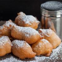 Zeppolis · Created with croissant dough so it maintains a flaky texture and a soft, richly flavored int...
