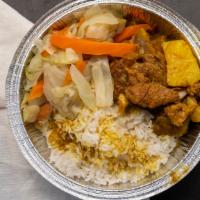 Curry Goat Dinner · Served with choice of salad and side.