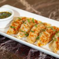 Pot Stickers · Pan Fried Dumplings Filled with Chicken, Mushrooms, Green Onion, Garlic, Sesame and Cilantro...