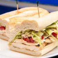 Roma · Grilled chicken, fresh mozzarella, roasted peppers, lettuce and balsamic dressing.