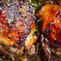 Jerk Chicken · Served with choice of rice and salad.