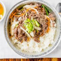 Marinated Beef (Bulgogi) Over Rice · Thinly sliced beef in Korean BBQ sauce with vegetables over rice served with miso soup.