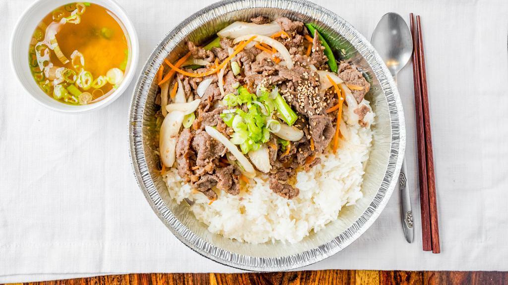 Marinated Beef (Bulgogi) Over Rice · Thinly sliced beef in Korean BBQ sauce with vegetables over rice served with miso soup.