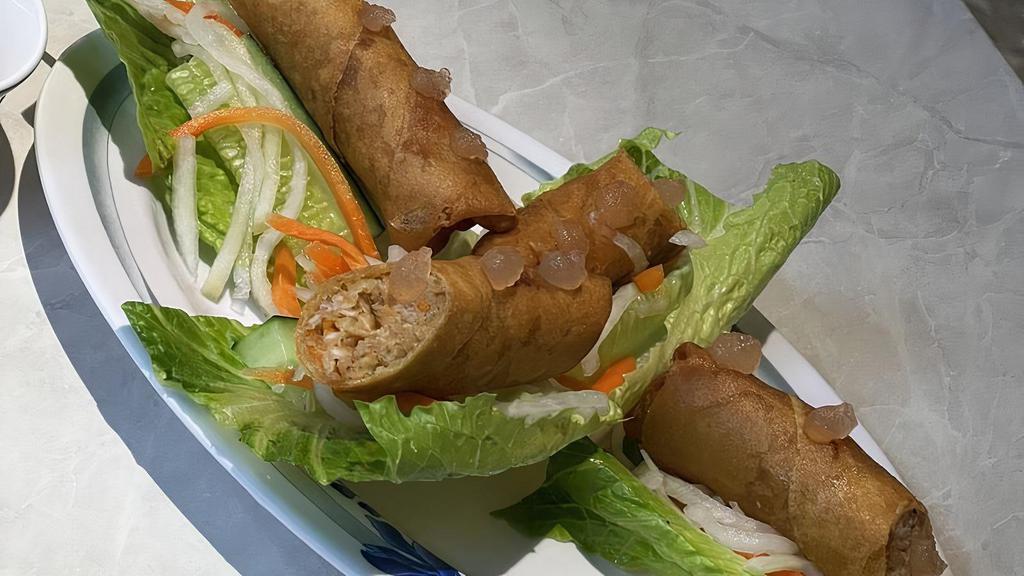 Spring Rolls / Chả Giò · Vegan option available. Ground pork, mixed with taro, shallots, onions, carrots, glass noodles. Served on lettuce with pickled carrots herbs. Topped with signature A.D.D. fish sauce crystals.