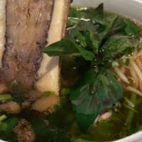 Bone Marrow & Eye Round Phở · Vietnamese street style, hand mincing eye round steak, textured and flavored with a piece of...