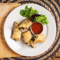 Melba'S Spring Rolls · Rice, Black Eyed Peas, Collard Green and Cheddar Cheese stuffed in a Spring Roll