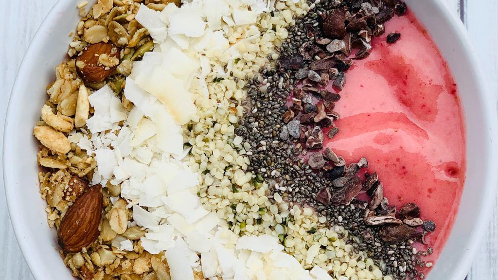 Strawberry Protein Bowl · Strawberries, banana, pea protein, oat milk, maca, vanilla, dates, and topped with house-made granola, coconut chips, chia seeds, hemp seeds & cacao nibs.