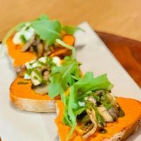 Mushroom Toast (Vegan) · Roasted mushroom, romesco, almond ricotta, arugula and drizzle of kale basil pesto on a hous...