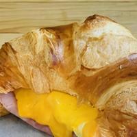 Ham, Egg, & Cheese Croissant · Smoked ham, organic egg, cheddar & chipotle aioli on a fresh baked plain croissant.
