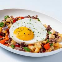 Steak, Sunny Side Up & Hash · Trio of slow cooked tender sliced beef paired with a perfectly cooked sunny side up egg and ...