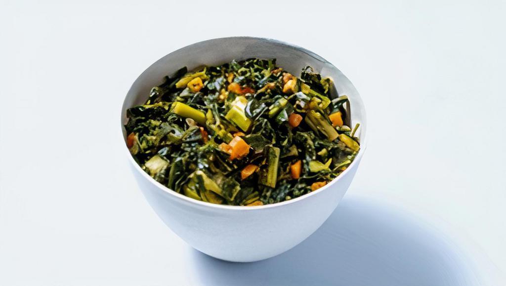 Collard Greens · Leafy braised collard greens with a mild, smoky flavor compliment any chicken dish.