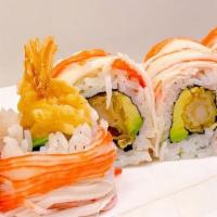 Angry Dragon · Shrimp tempura, avocado, topped with crab meat With a glaze of spicy mayo on top! mhm!