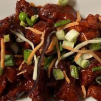 Chilli Chicken · Crispy chicken, onion, pepper, tossed with tangy chilli sauce.