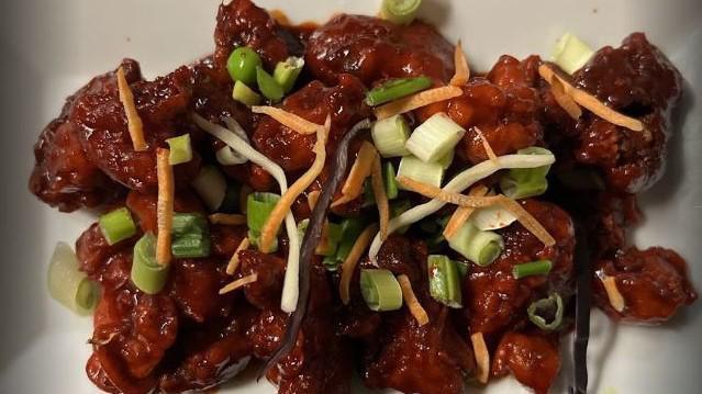Chilli Chicken · Crispy chicken, onion, pepper, tossed with tangy chilli sauce.