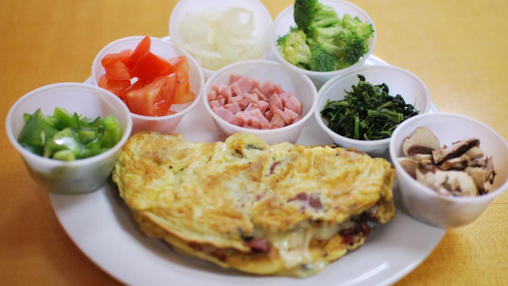 Vegetarian Omelet · Peppers, onions, mushroom, tomatoes, spinach.