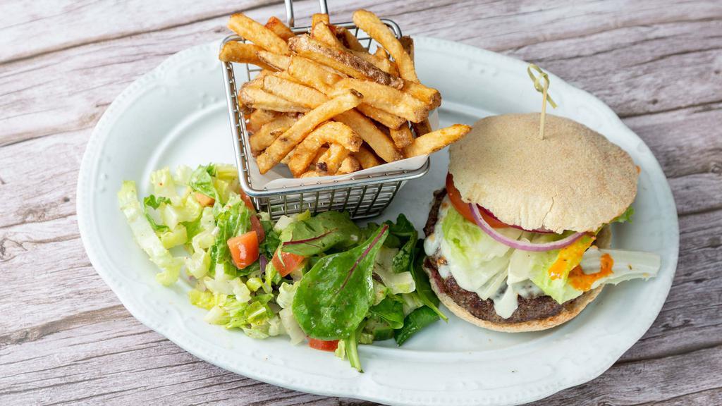 Nomad Burger · Beef burger, cheddar cheese, lettuce and tomato. Served with French fries.