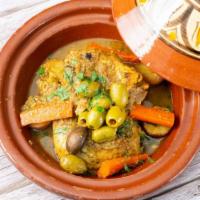 Chicken Tagine · Braised chicken, cooked with blend spices, Mediterranean herbs and preserved lemons and oliv...