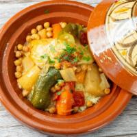 Vegetarian Couscous · Stewed vegetables over couscous with broth.