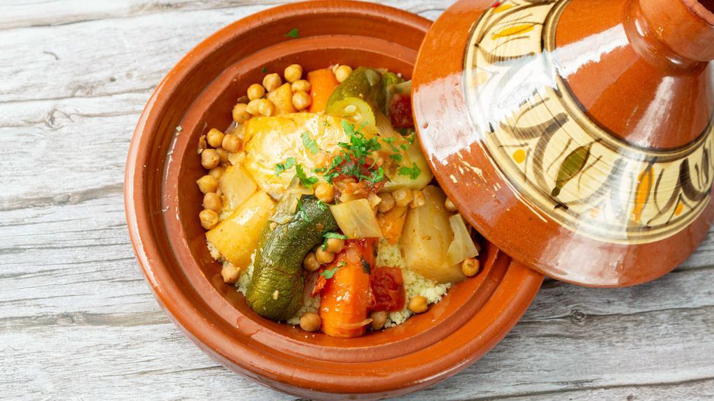 Vegetarian Couscous · Stewed vegetables over couscous with broth.