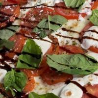 Tomato Basil Pizzette (Personal) · Cheese Blend, diced tomato, basil, parmesan cheese, garlic and olive oil crust, balsamic dri...